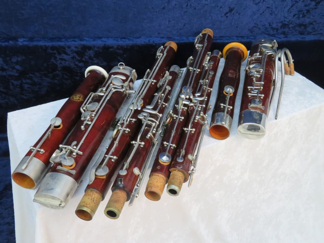 Pair of Wood Bassoons Schreiber Serial #10093 and Conn Serial #18690 Pair of Wood Bassoons Schreiber Serial #10093 and Conn Serial #18690
